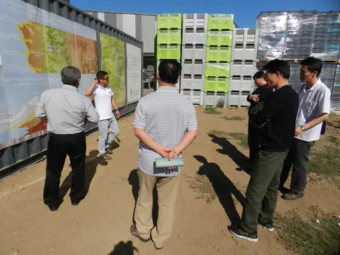Visitors reading a large Quintay Wine Estate map board explaining the Casablanca Valley's maritime influence